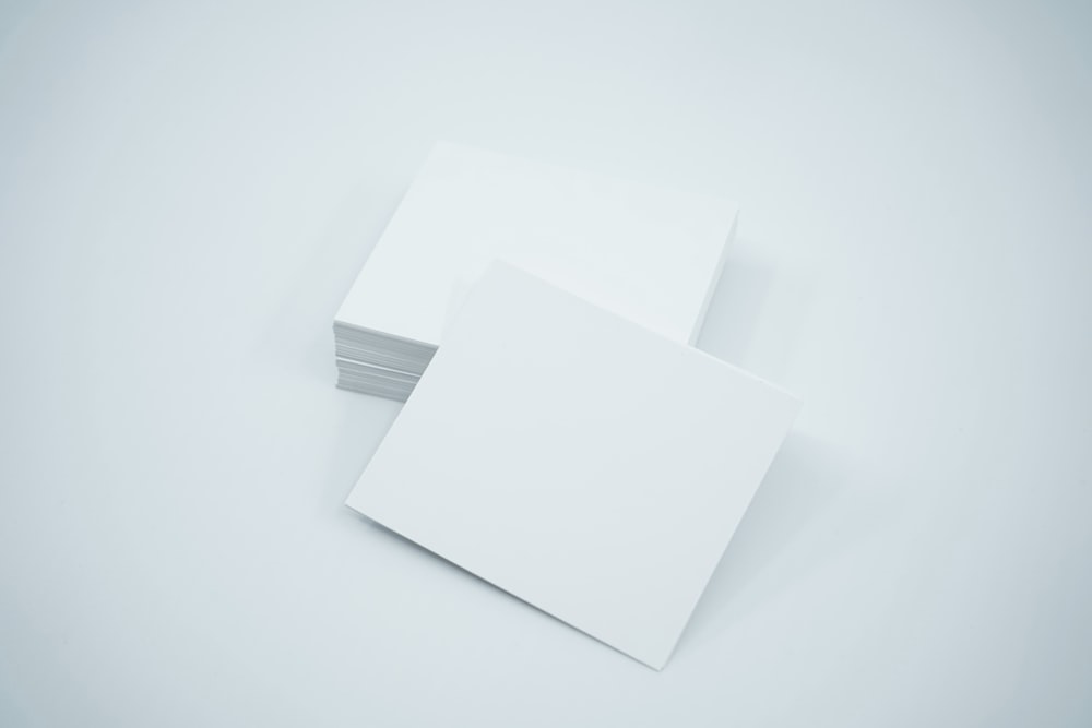 a stack of white cards sitting on top of each other