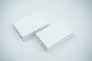 Six white rectangular team member cards arranged in a clean, responsive grid with blue headings and subtle hover effects.