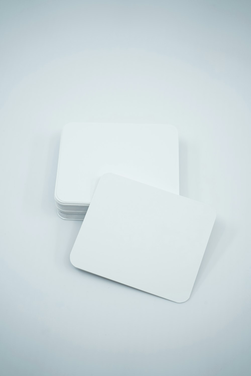 a stack of white cards sitting on top of each other