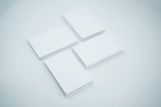 three blank cards sitting on top of each other