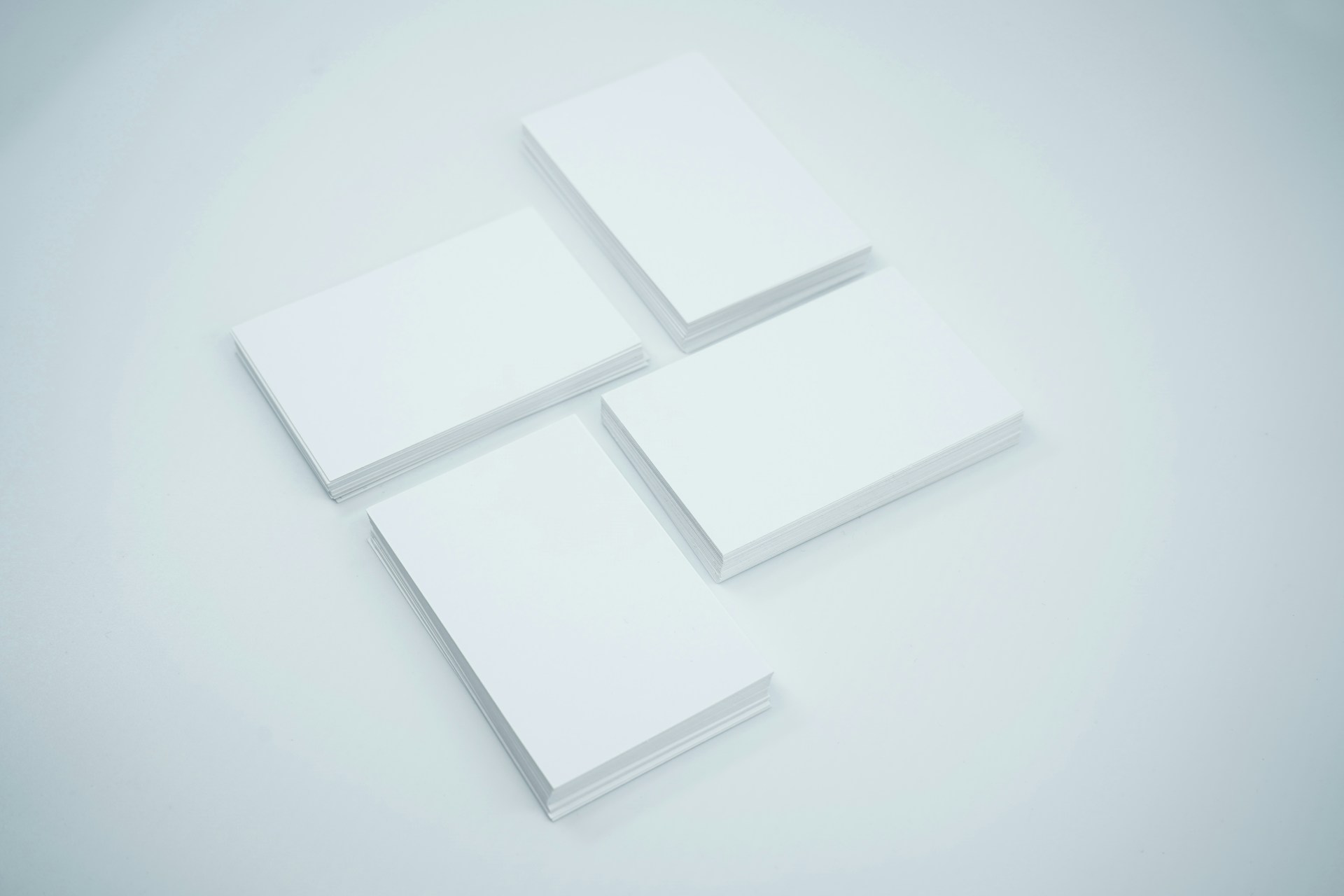 three blank cards sitting on top of each other