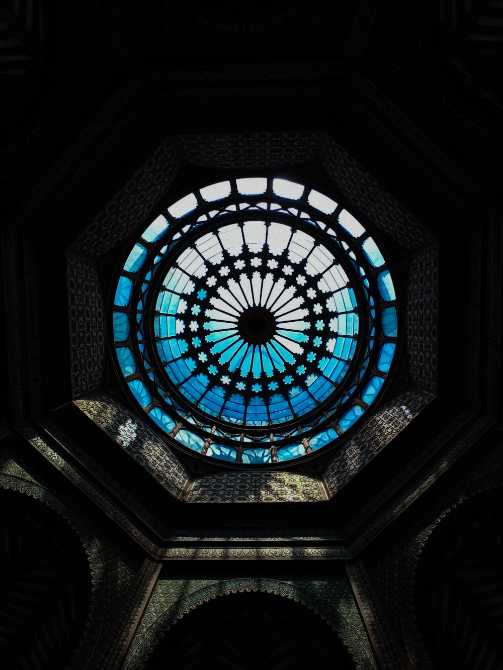 a circular stained glass window in a building