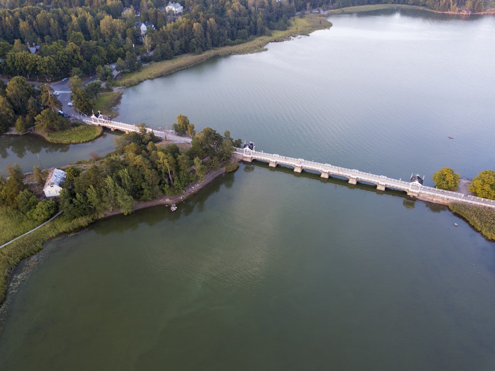 an aerial view of a bridge over a body of water