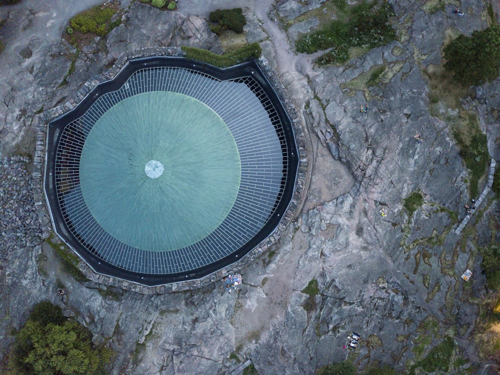 an aerial view of a building with a circular roof