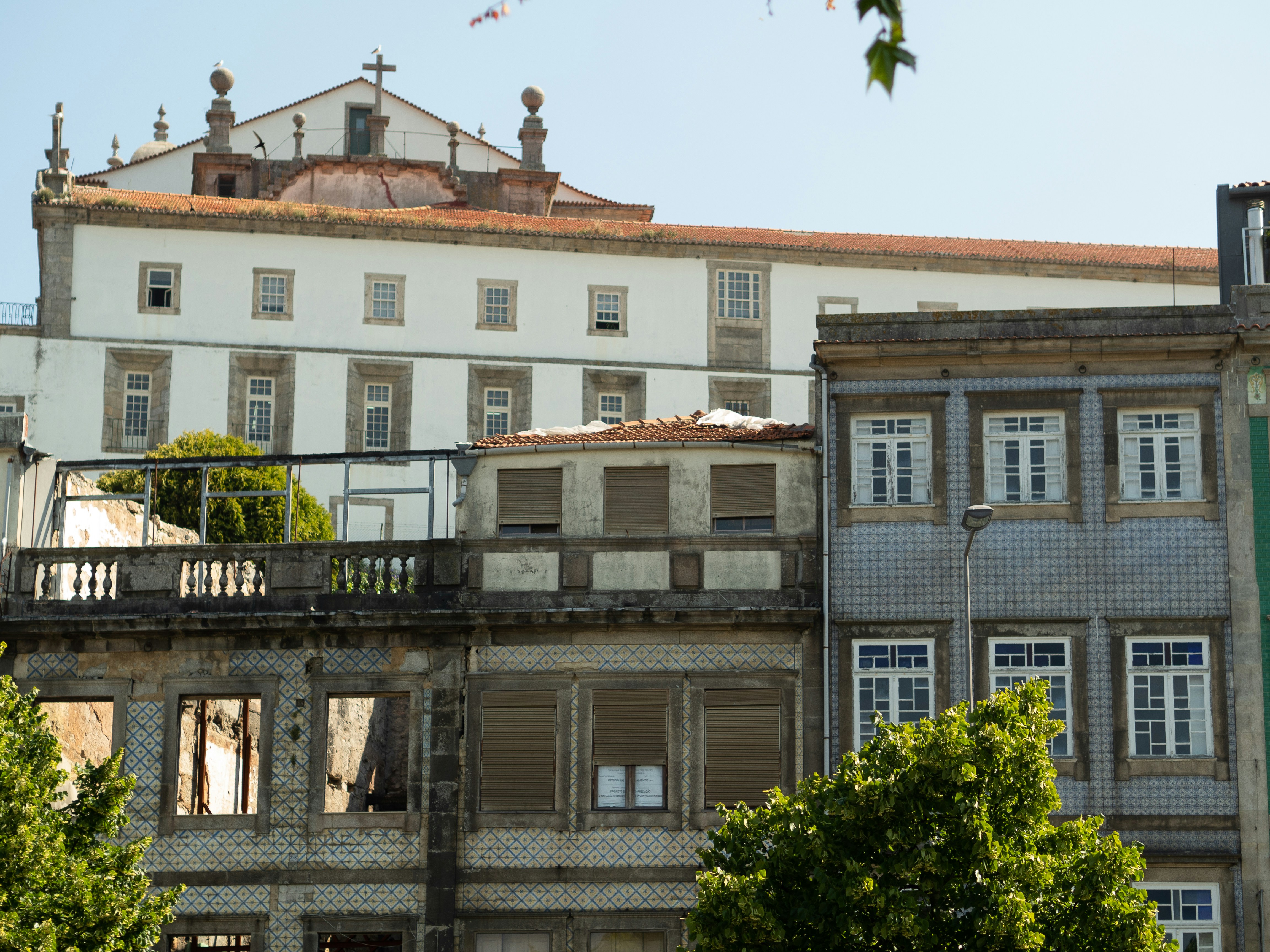 an old building with a clock on the top of it