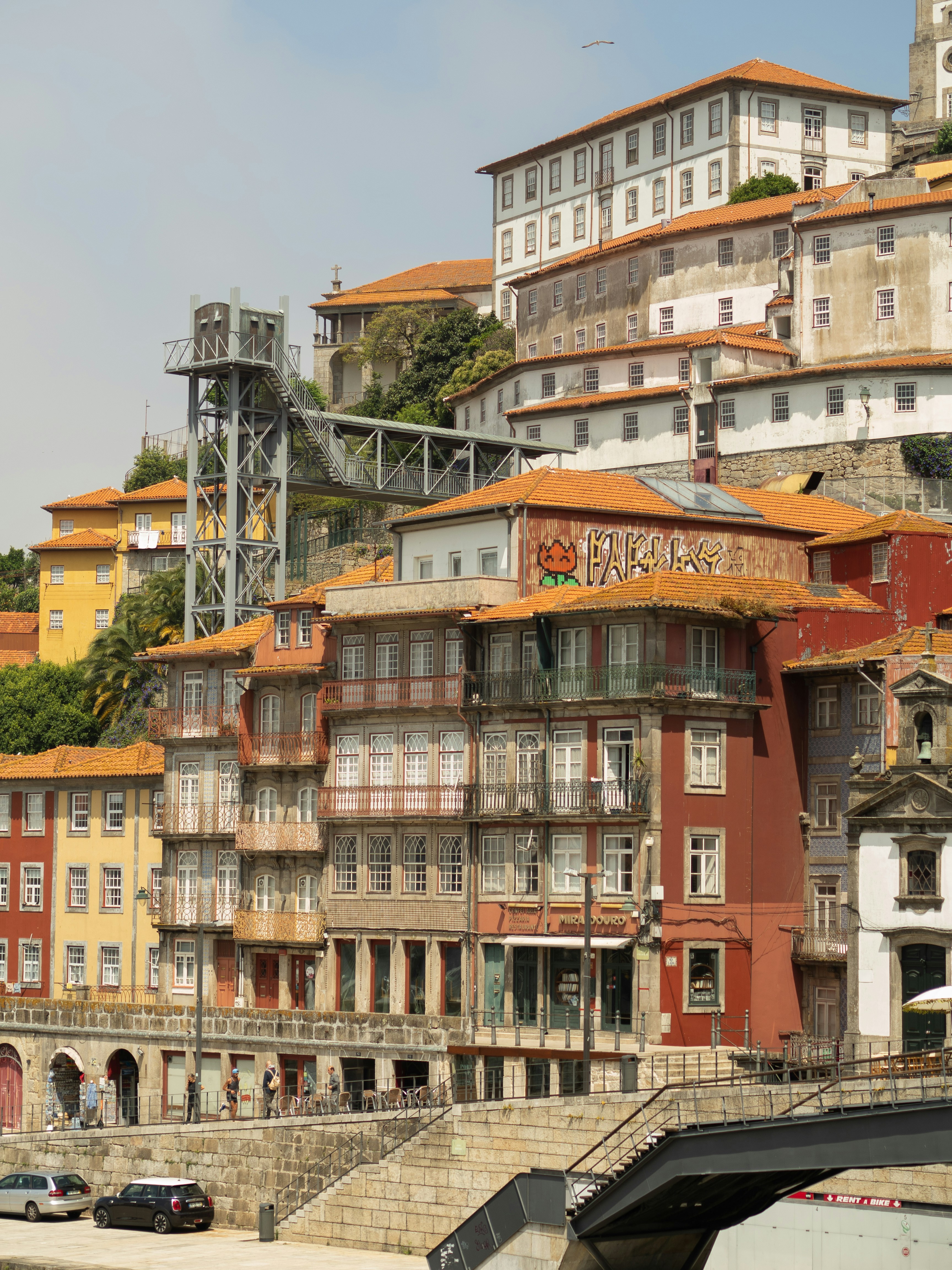 a group of buildings on the side of a river
