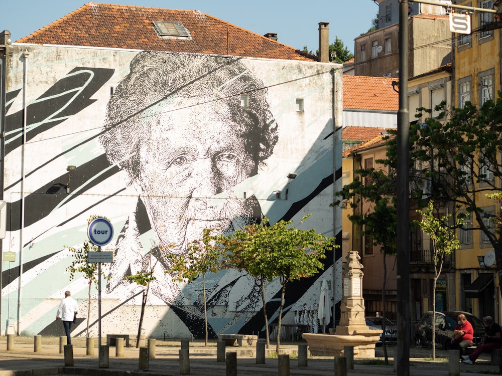 a large mural of a man on the side of a building