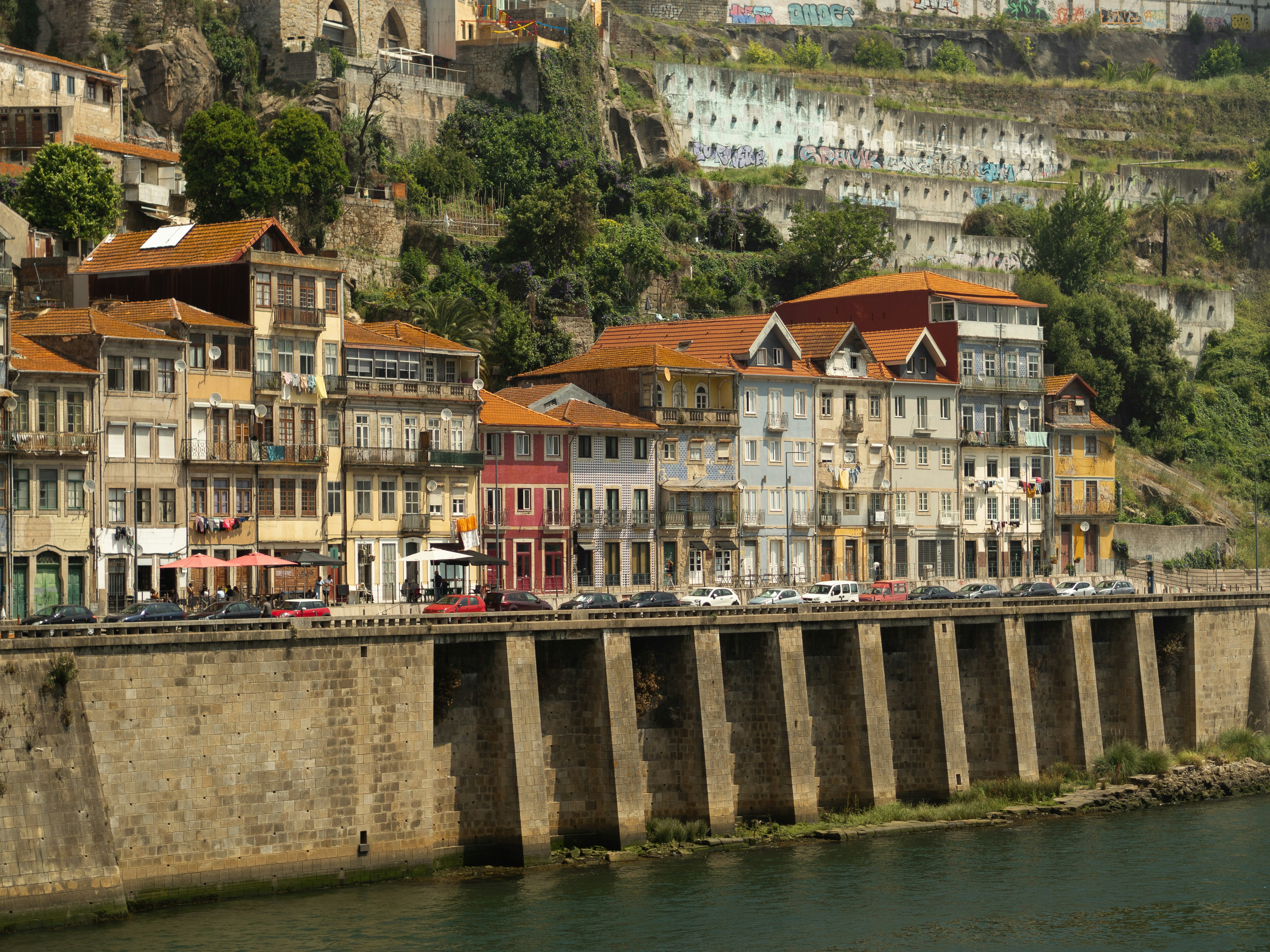 a river running through a city next to tall buildings