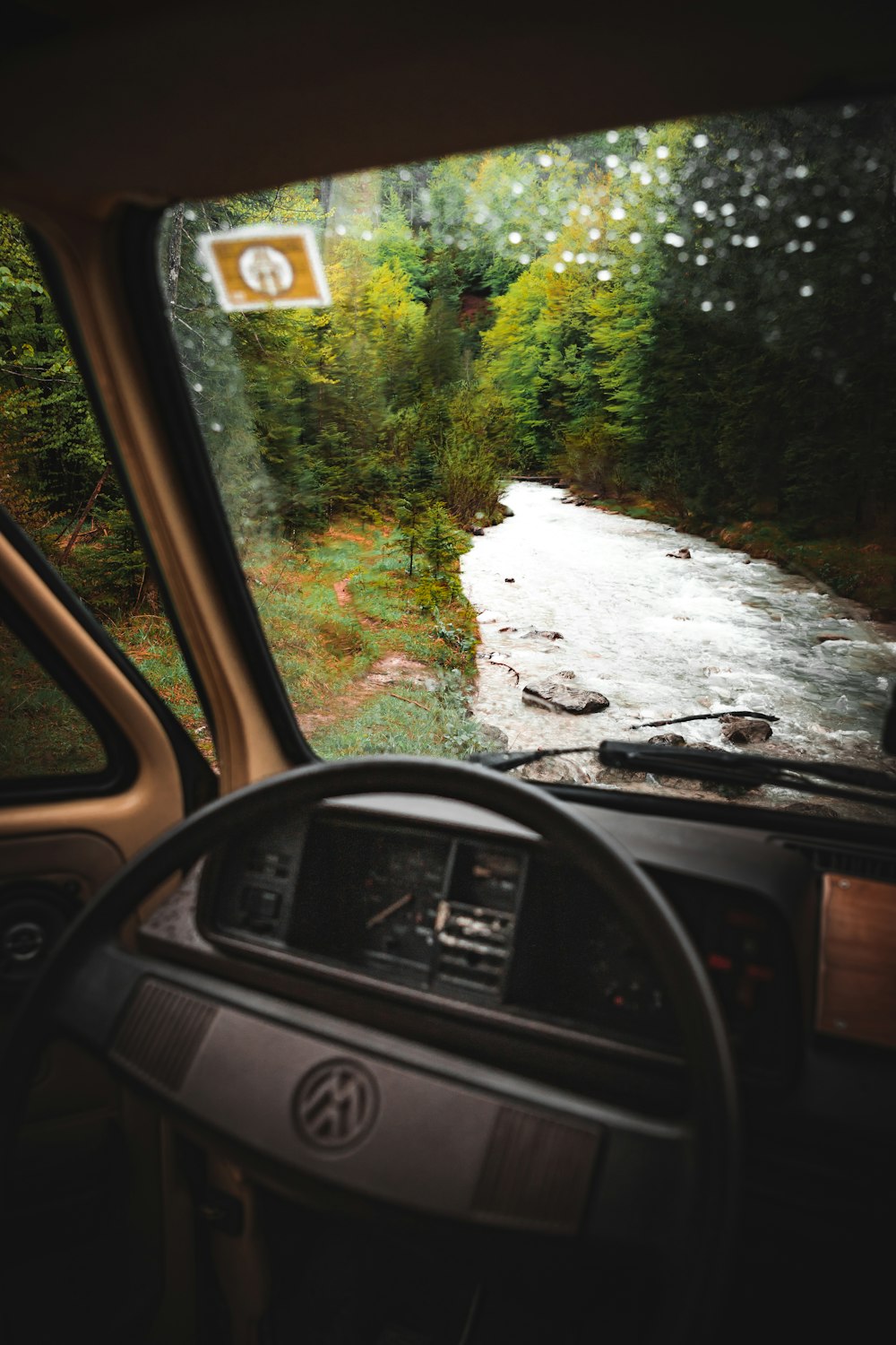 a view from inside a vehicle looking at a river