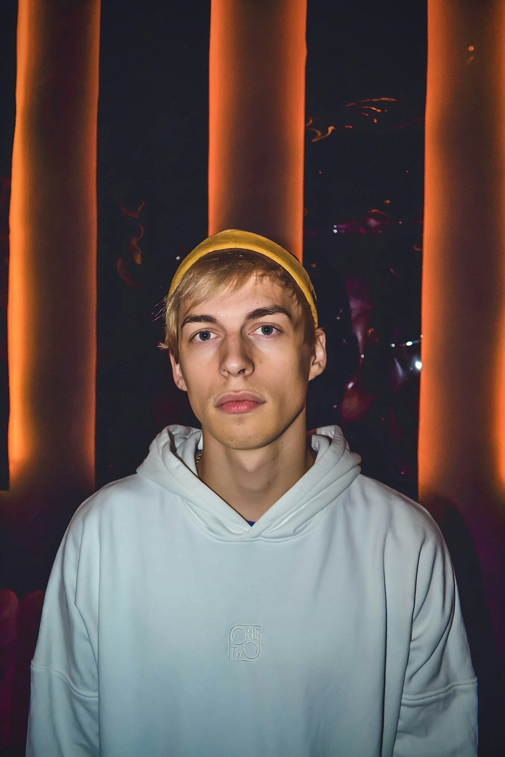 a young man wearing a yellow head band