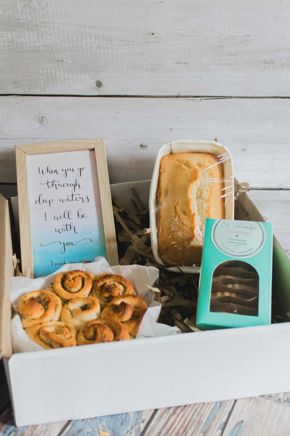 a box filled with a variety of baked goods