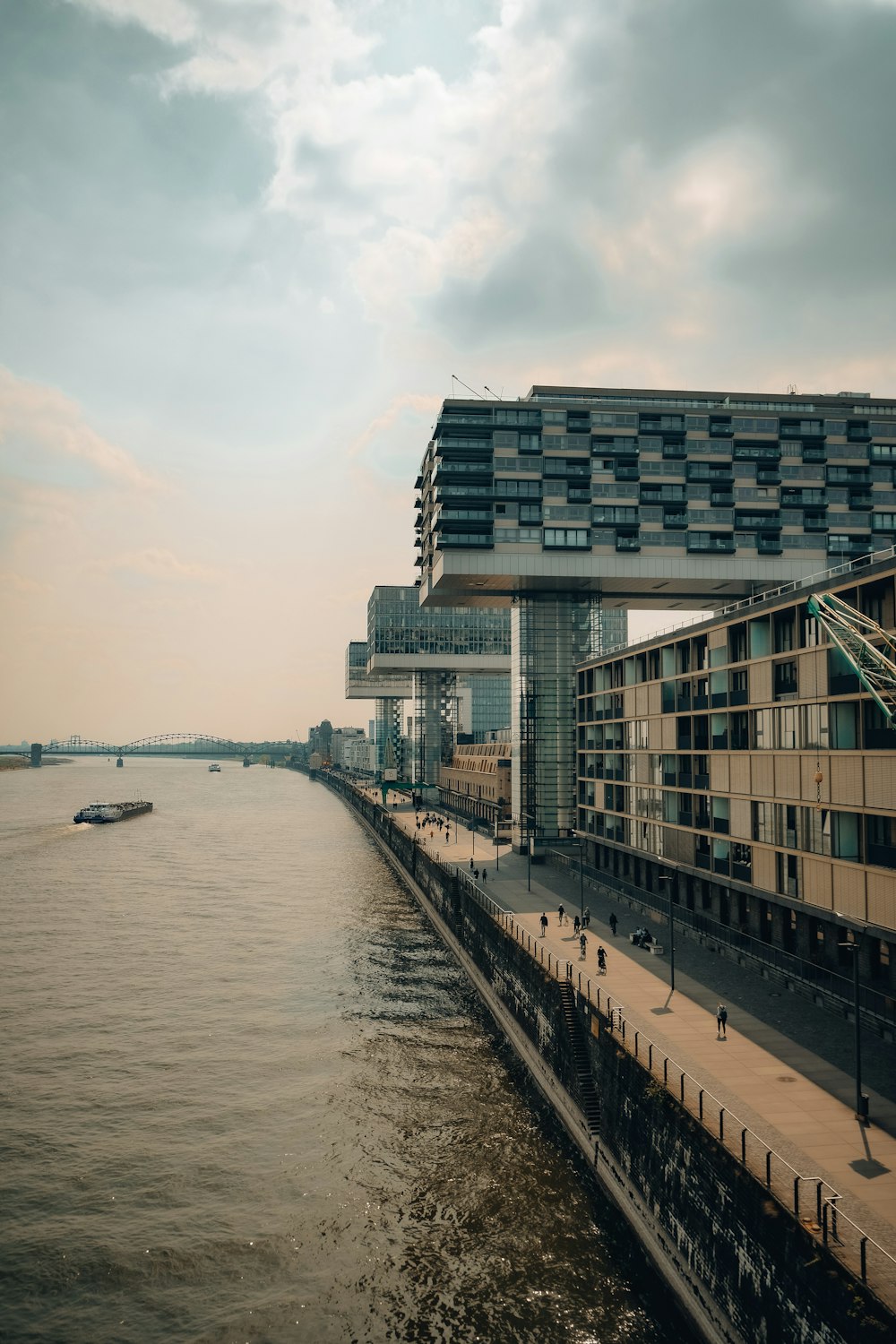 a large body of water next to a tall building