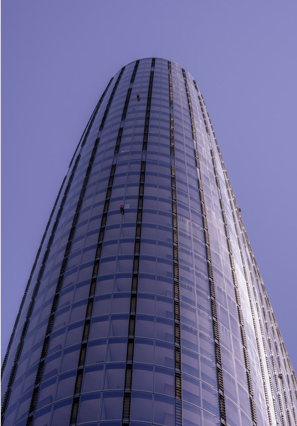 a very tall building with a sky background