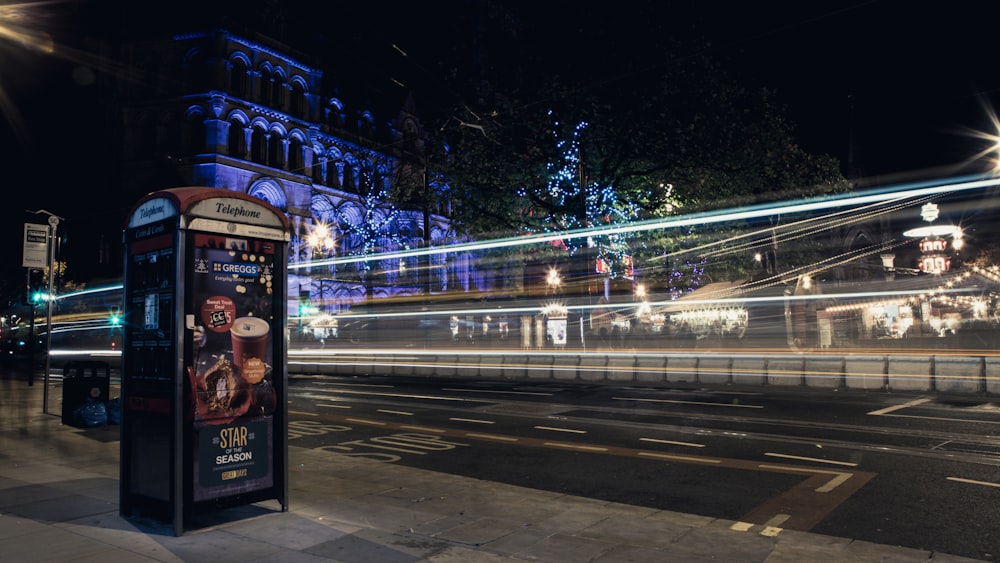 a bus stop sitting on the side of a road