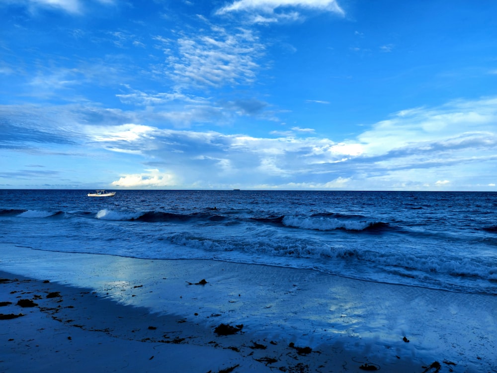 a boat is in the distance on the ocean