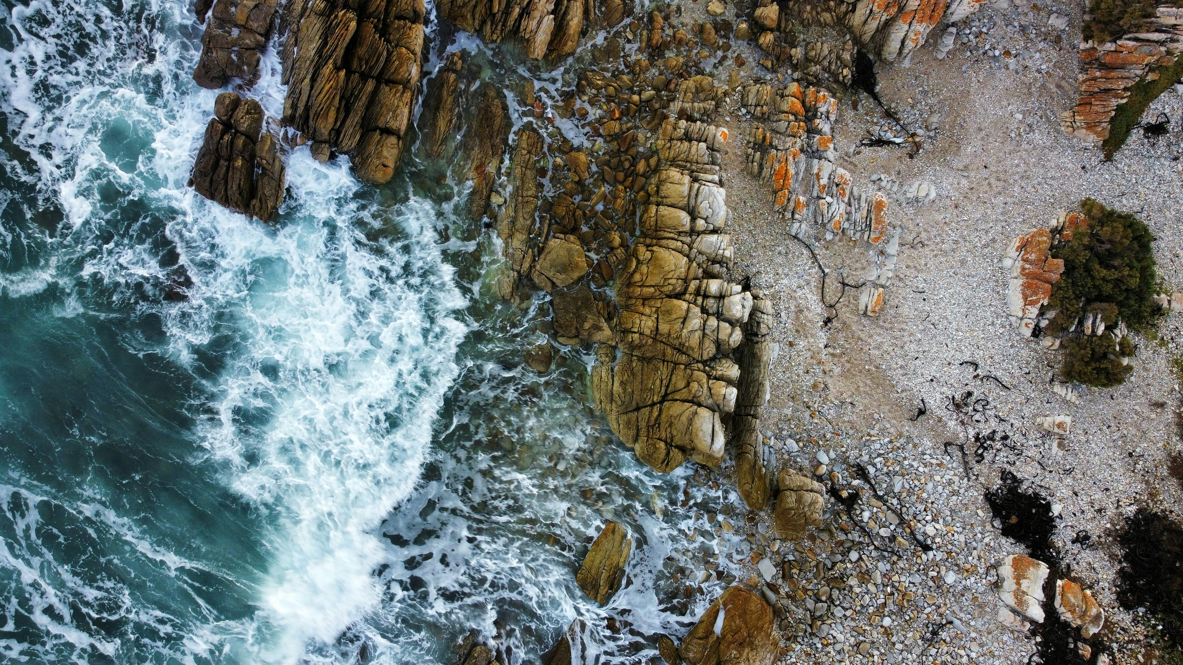 a bird's eye view of a rocky beach