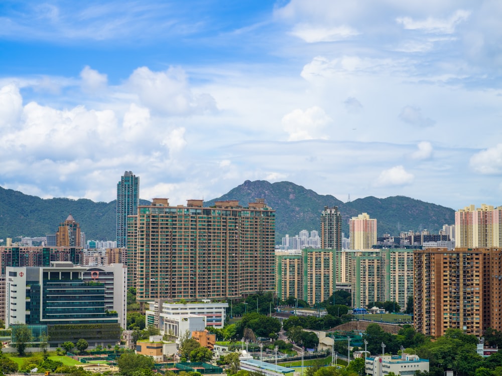 a view of a city with mountains in the background