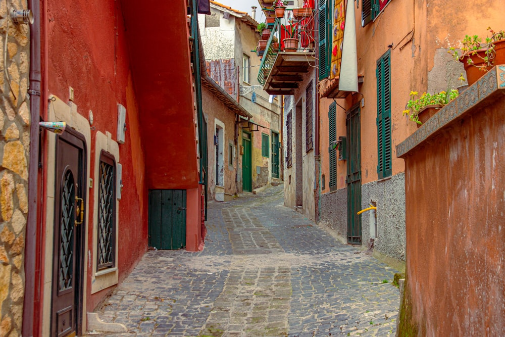 a narrow cobblestone street lined with buildings