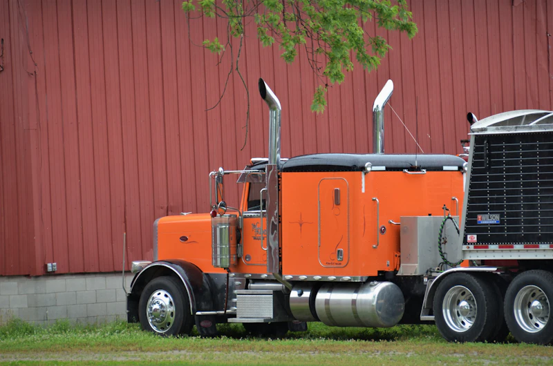 Orange Peterbilt semi truck
