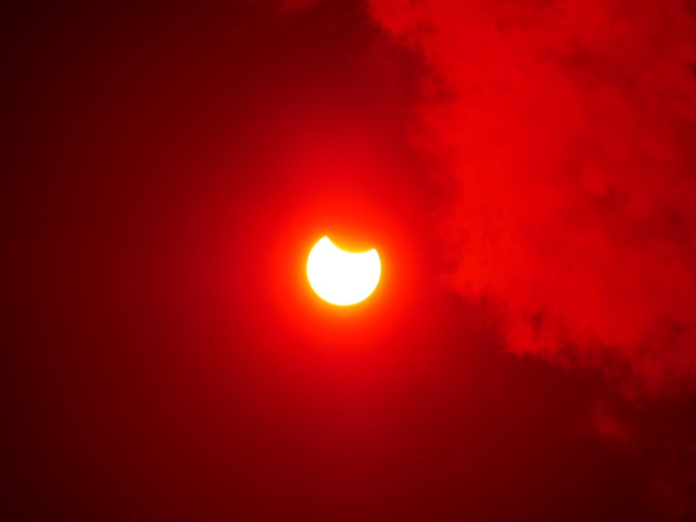 the sun is seen through a cloud of smoke