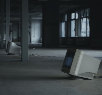 white crt computer monitor on white table