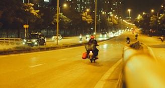 Night view of Istanbul with a Konum Kurye motorcycle riding under city lights