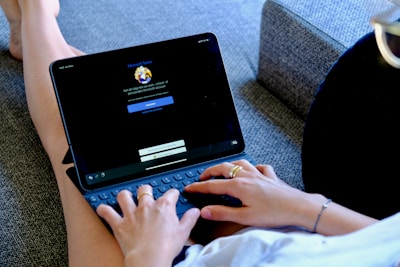 person using black laptop computer