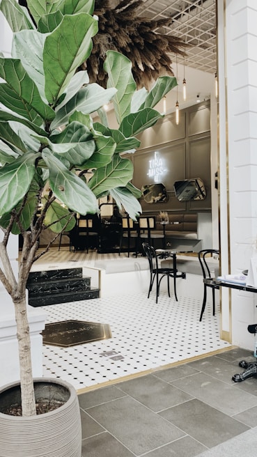 Elegant café interior featuring vibrant artificial greenery that brightens the space without maintenance