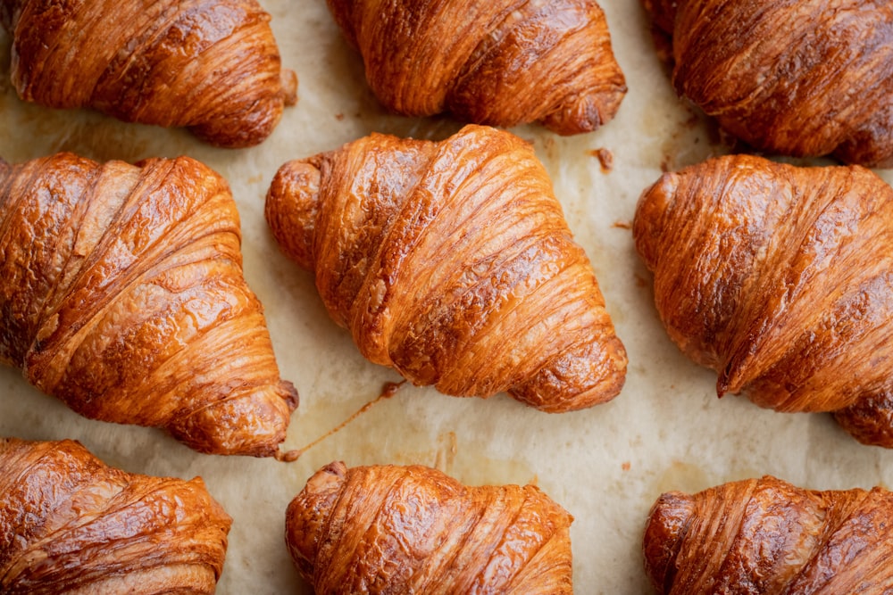 a bunch of croissants that are on a table