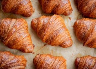 a bunch of croissants that are on a table