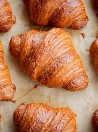 a bunch of croissants that are on a table