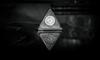 a small clock sitting on top of a table