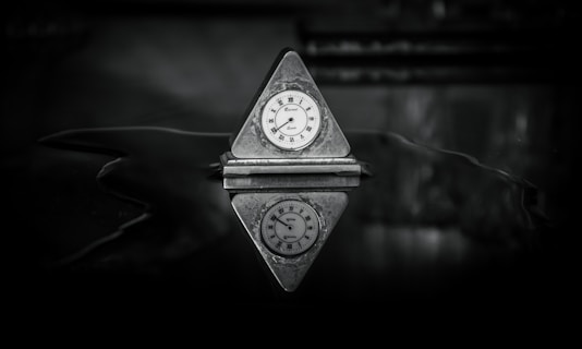 a small clock sitting on top of a table