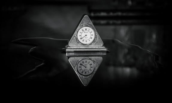 a small clock sitting on top of a table