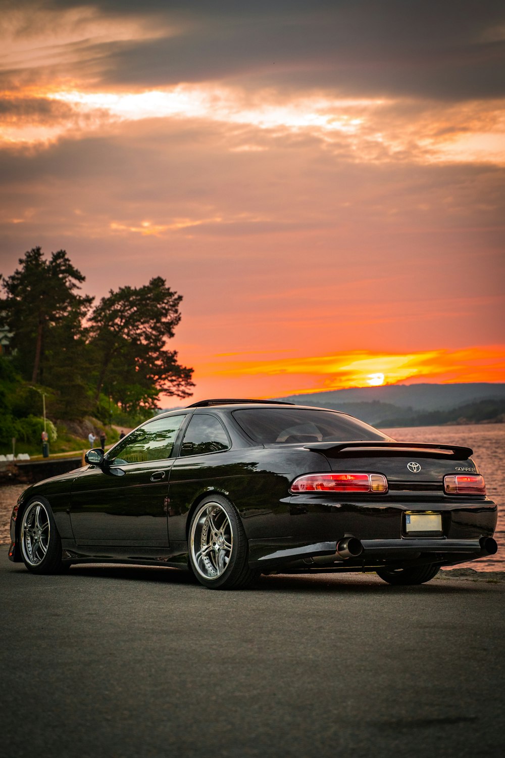 a black sports car parked on the side of the road