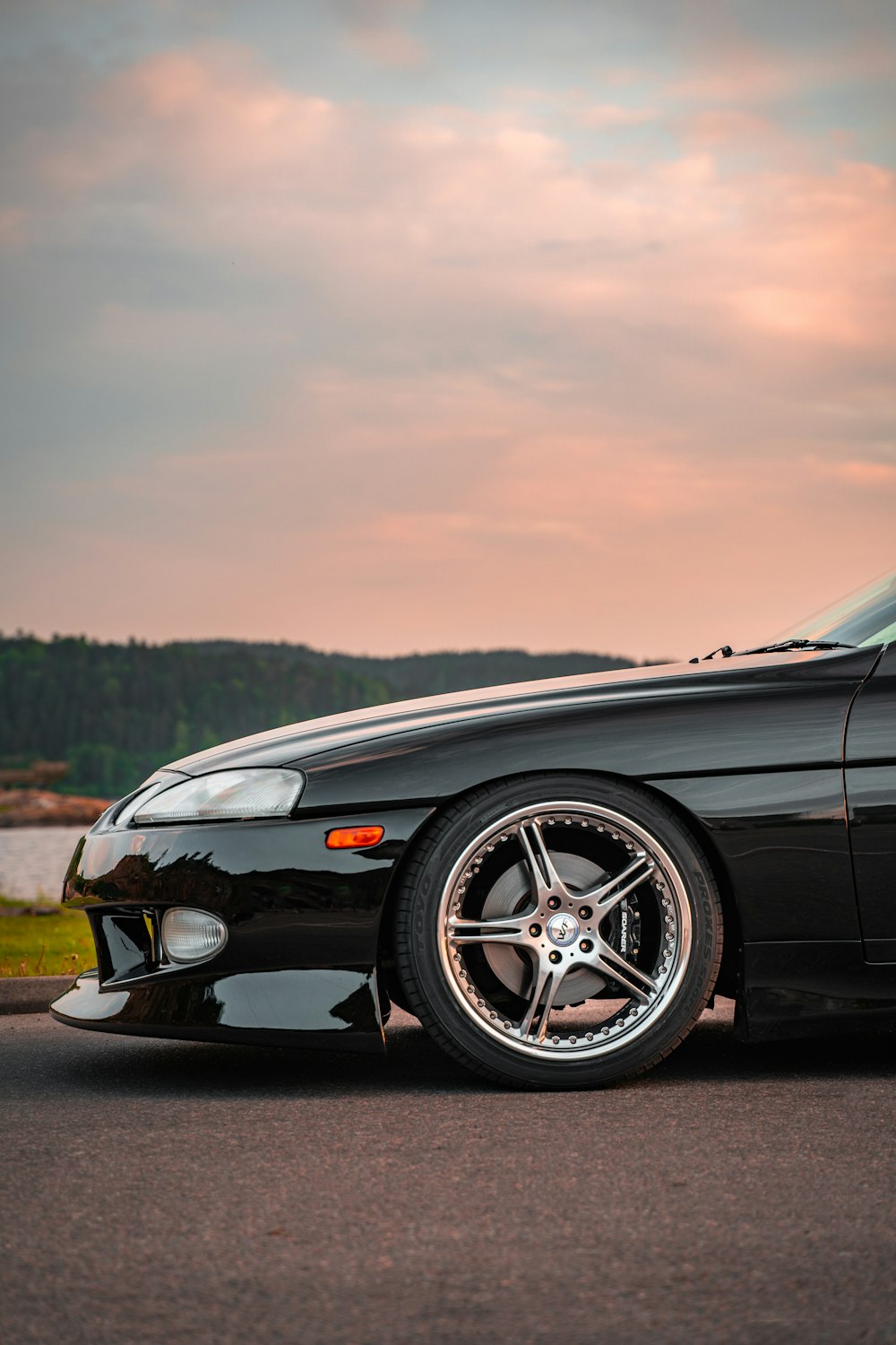 a black sports car parked on the side of the road