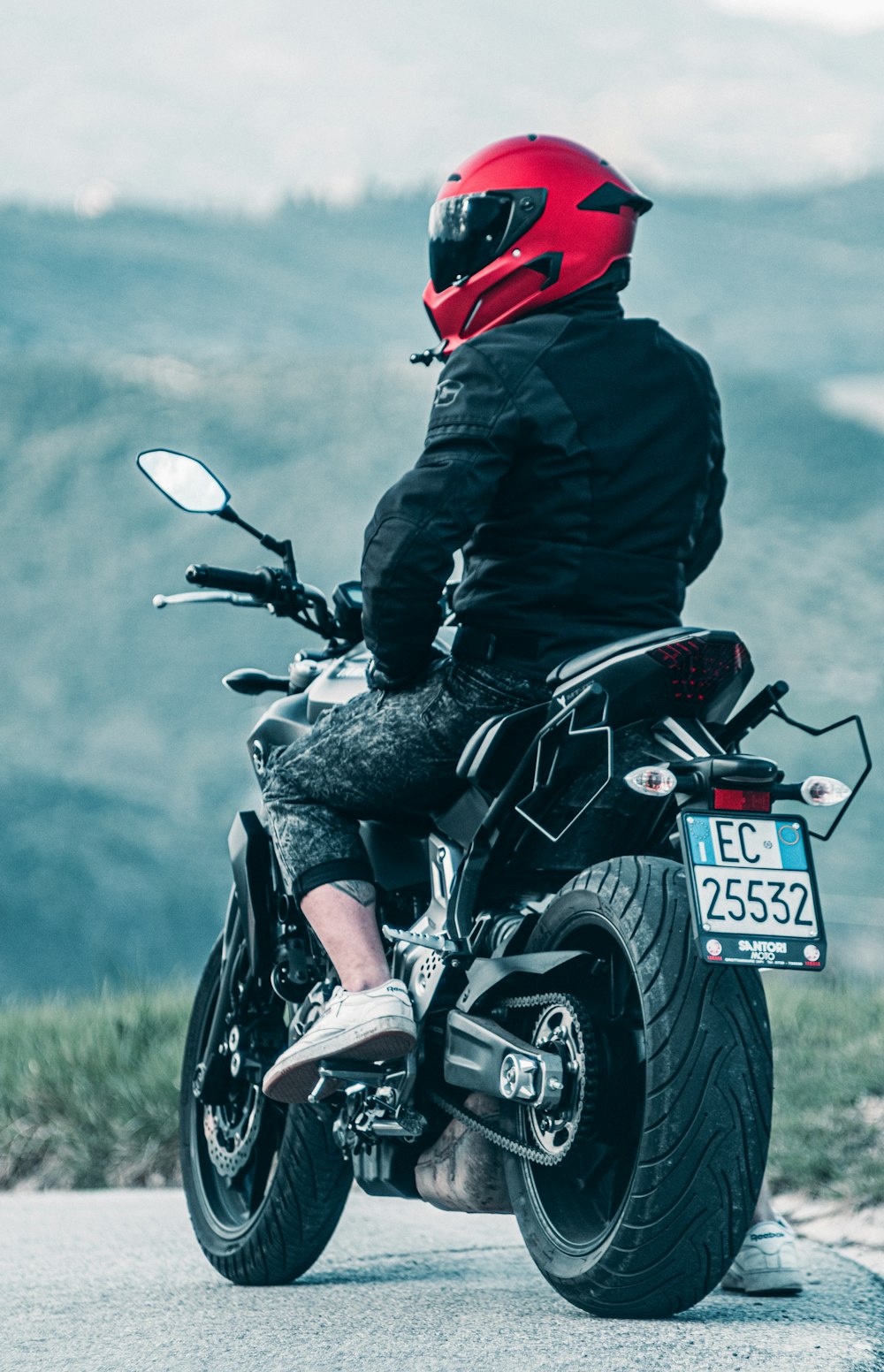 a person riding on the back of a motorcycle