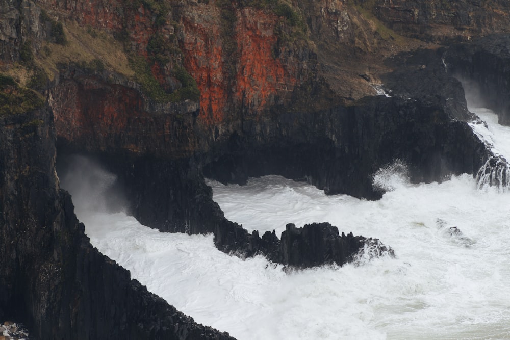 a large body of water surrounded by rocky cliffs