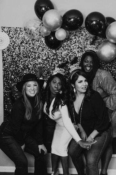 a group of women standing next to each other