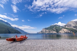 A serene lakeside view with kayaks ready for an afternoon adventure
