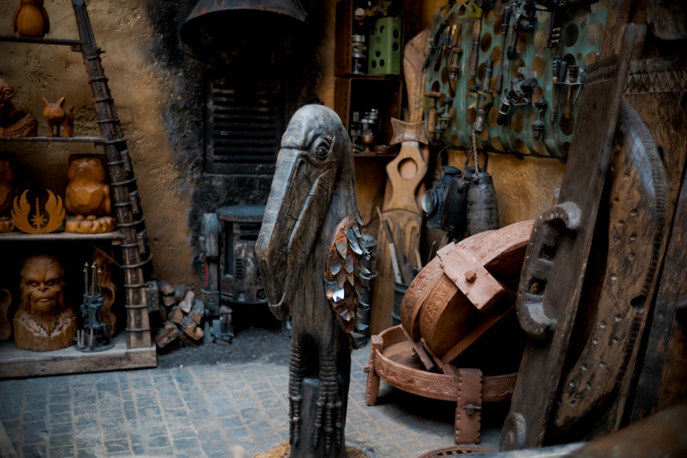 a wooden statue of a woman in a shop