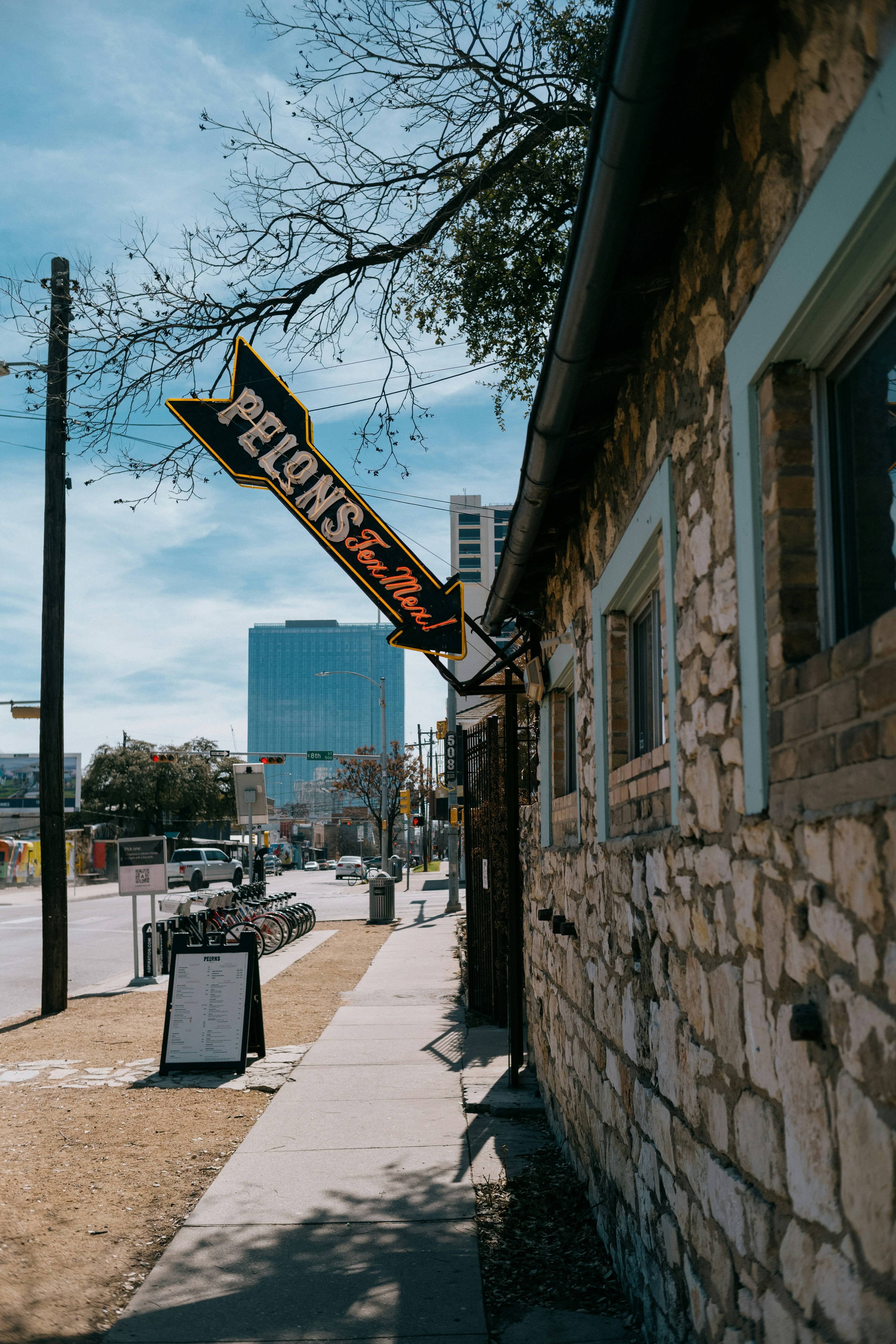 a street sign hanging from the side of a building