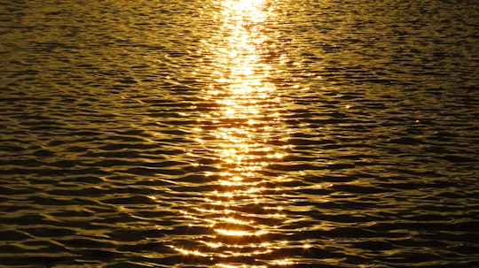 body of water during sunset in Vardavar Lake Armenia