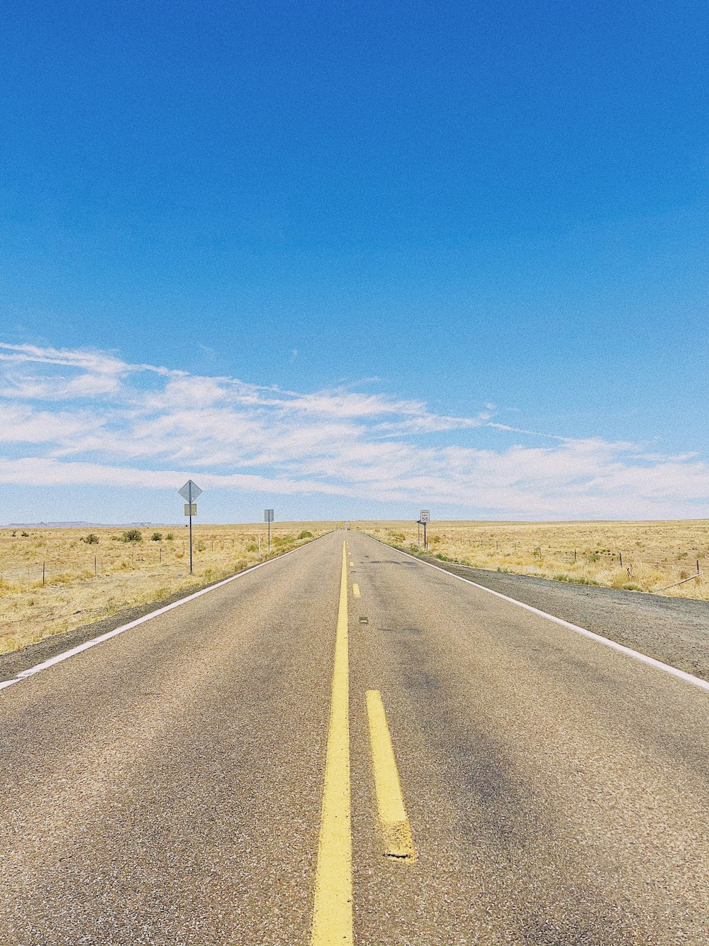 an empty road in the middle of nowhere