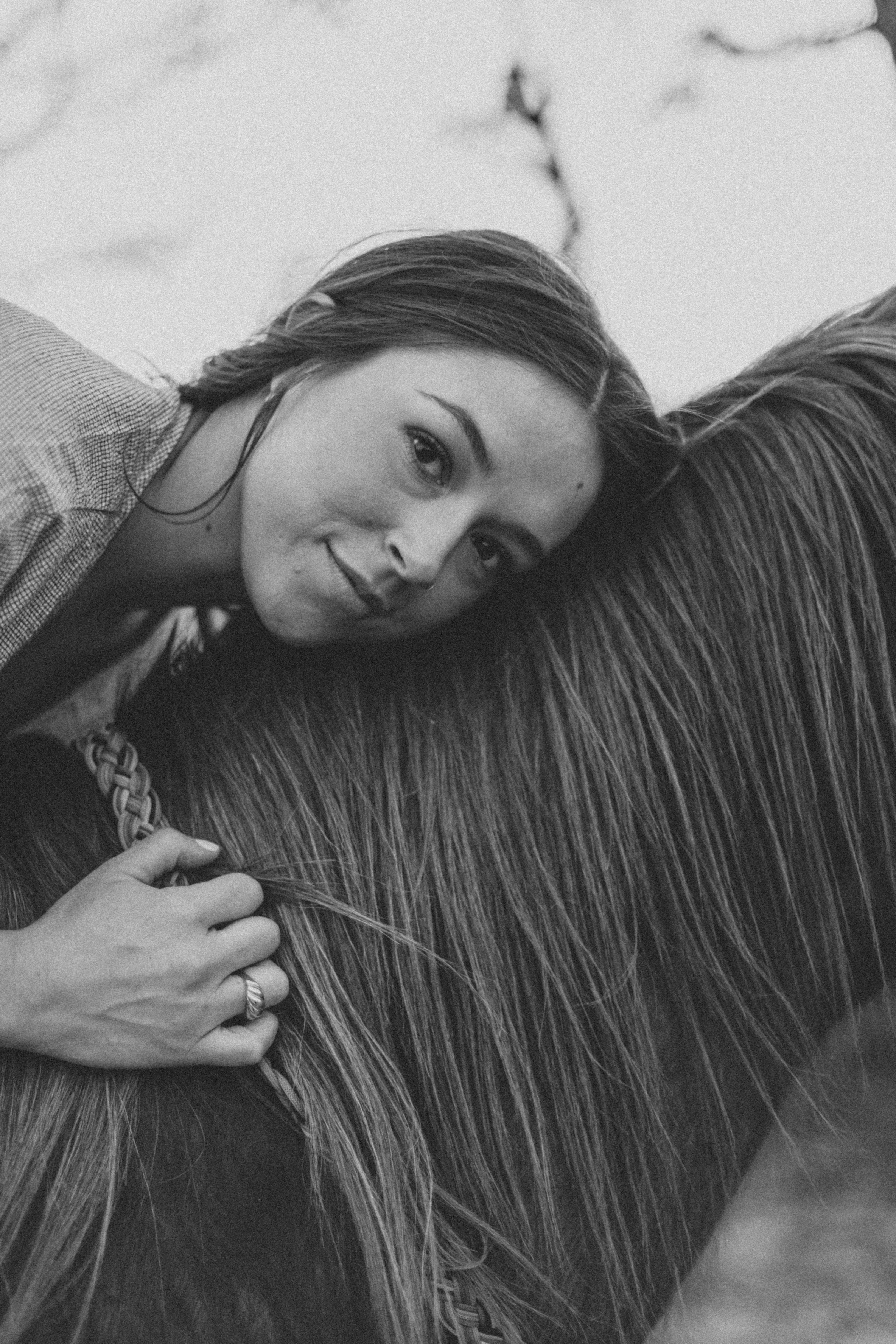 grayscale photo of woman in knit sweater