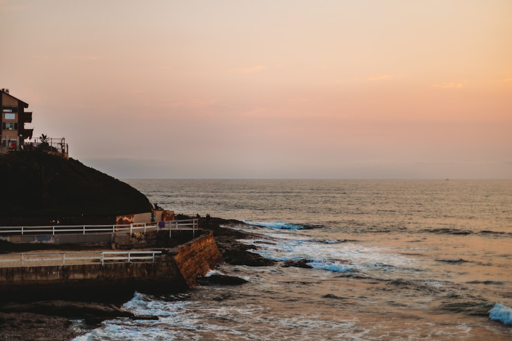 brown wooden dock on sea during daytime