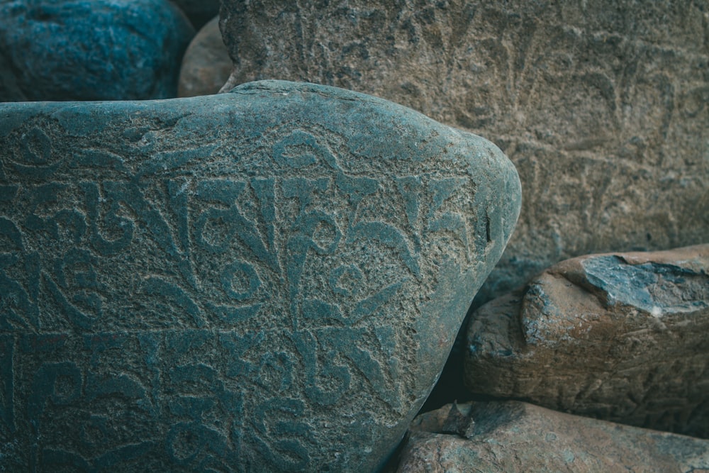 a close up of a rock with writing on it