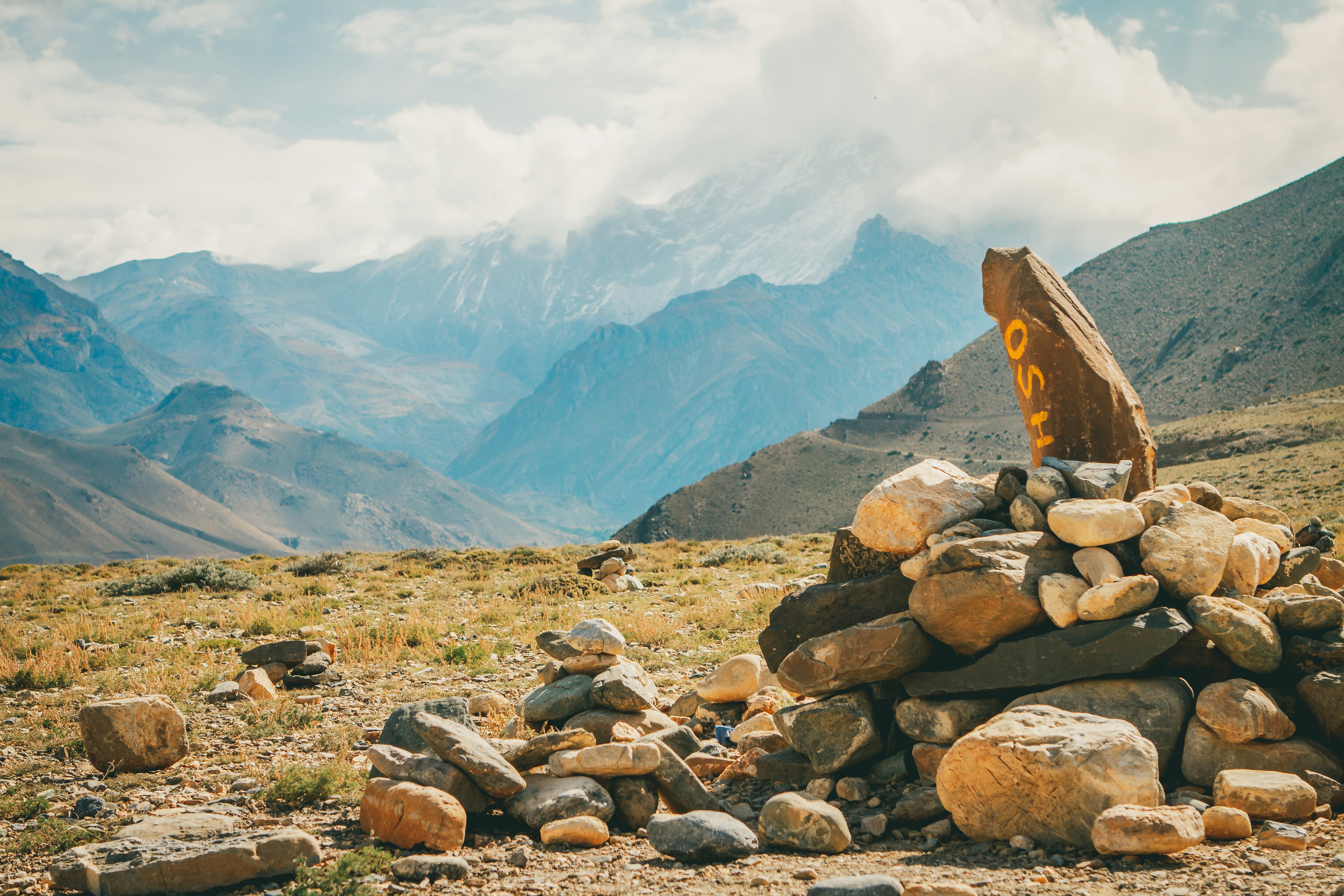 A pile of rocks on the side of a mountain photo – Free Muktinath Image ...
