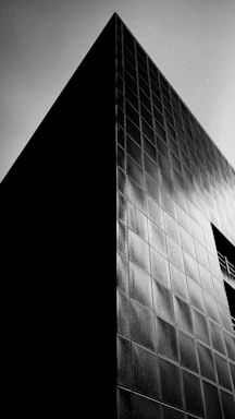 a stark black and white architectural blueprint with sharp grids and bold lines