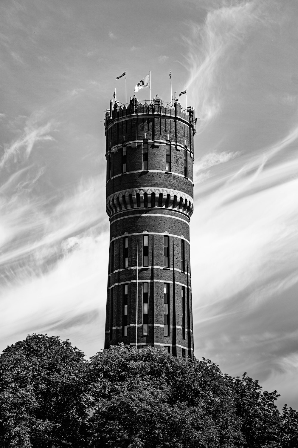 a black and white photo of a tall tower